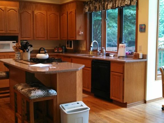 Plenty of room for China Cabinet and a large gathering around the table in this formal dining room. Note chair rail and trim work adding to the quality touches to the home.  
