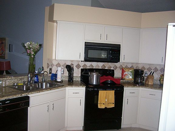 Kitchen with granite counters, brand new Maytag dishwasher and faucet.