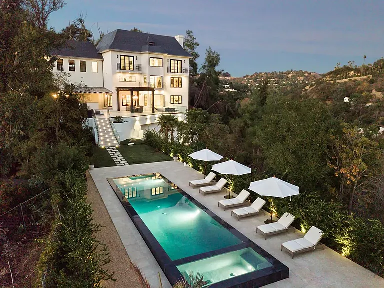 Outdoor lighting emphasize this property's classical beauty.