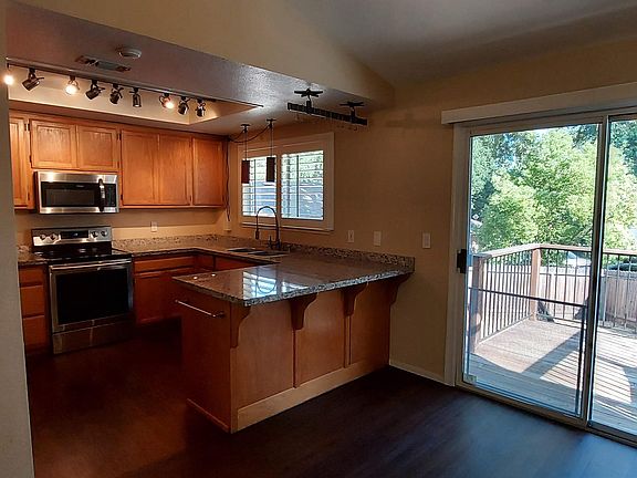 Adjacent Dining Area Leads Out to the Backyard.