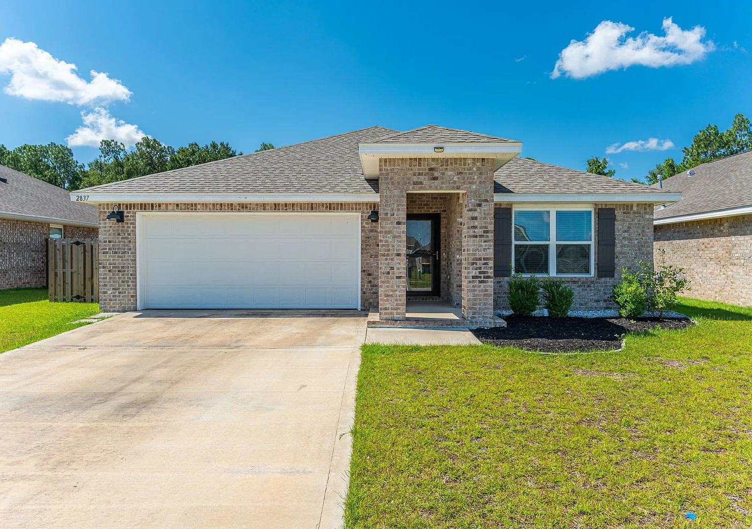 Modern 4-Bedroom All-Brick Home in Crestview with Spacious Yard, Upgrades and Community Pool — Photo 1