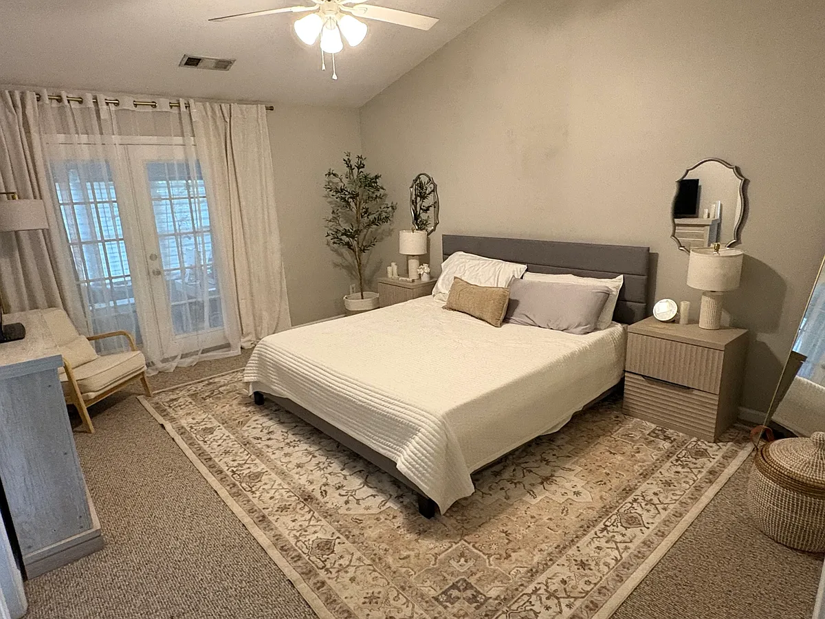 Serene primary suite designed with comfort and simplicity in mind, featuring soft neutral finishes, generous natural light, and a peaceful retreat atmosphere. - 305 Cadeleigh Ct
