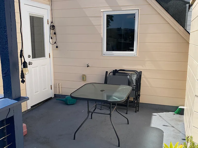 Private patio with table and chairs