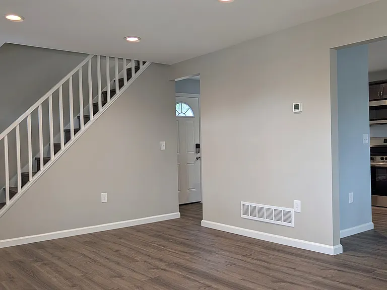 Livingroom-Upstairs to Second Floor Bath and 3 Bedrooms