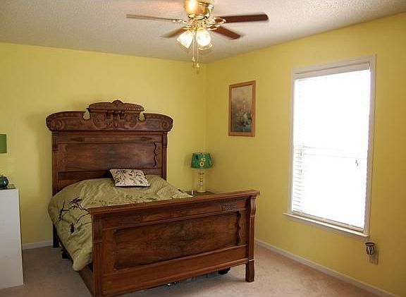 15x10 Master Bedroom with ceiling fan large enough for oversized furniture.