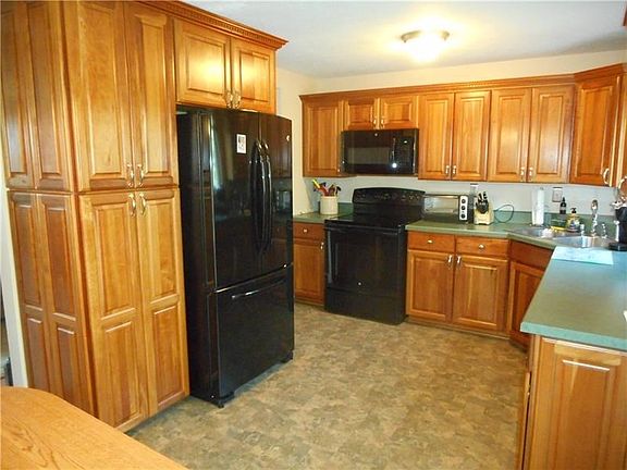 Kitchen: Whip up a quick snack or prepare a gourmet meal in this custom designed kitchen. This exquisitely detailed kitchen make