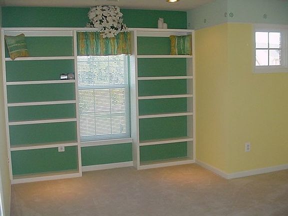 Bedroom with built-in bookcase