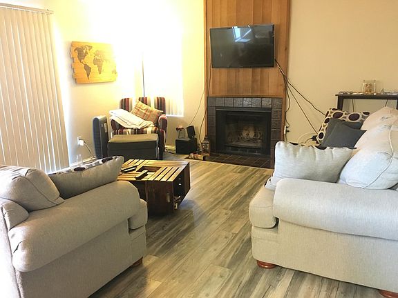 Living room with wood fire place