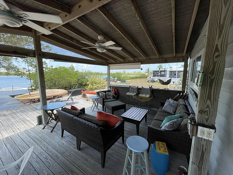 Covered outside sitting area overlooking the water