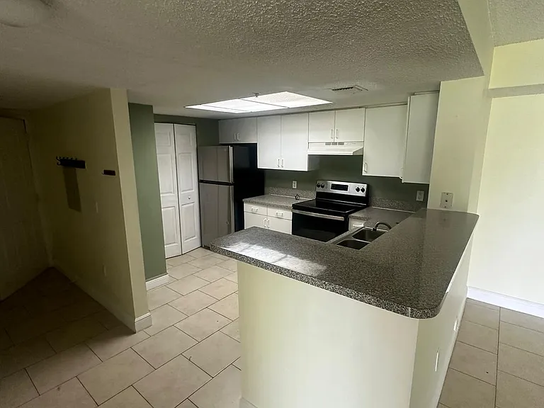 5005 Wiles Rd #102 — Photo 33
