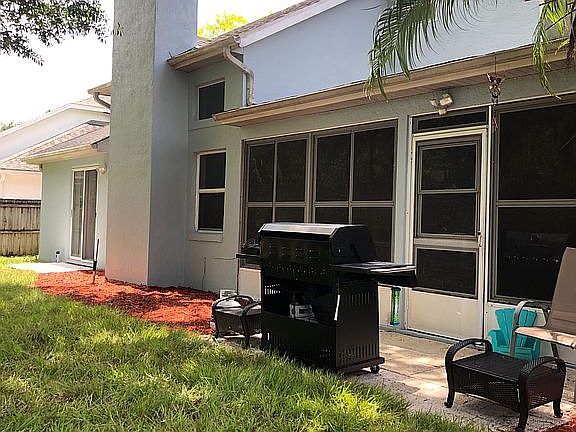 Backyard BBQ facing sunroom