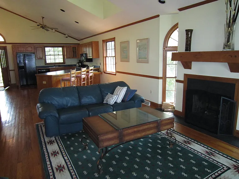 LR/Great Room facing Kitchen w/ (nonworking) Fireplace on right