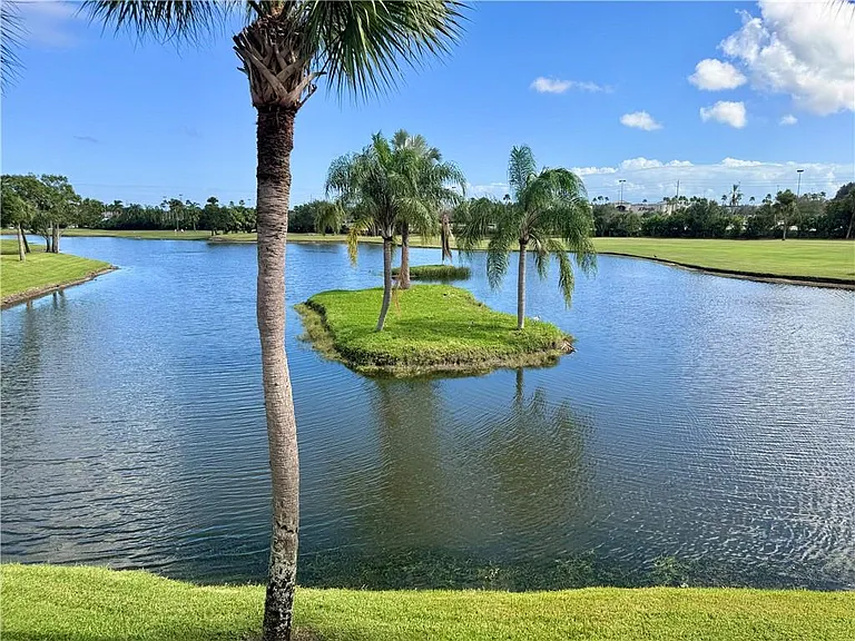 Enjoy stunning lake & golf course views from the living room!