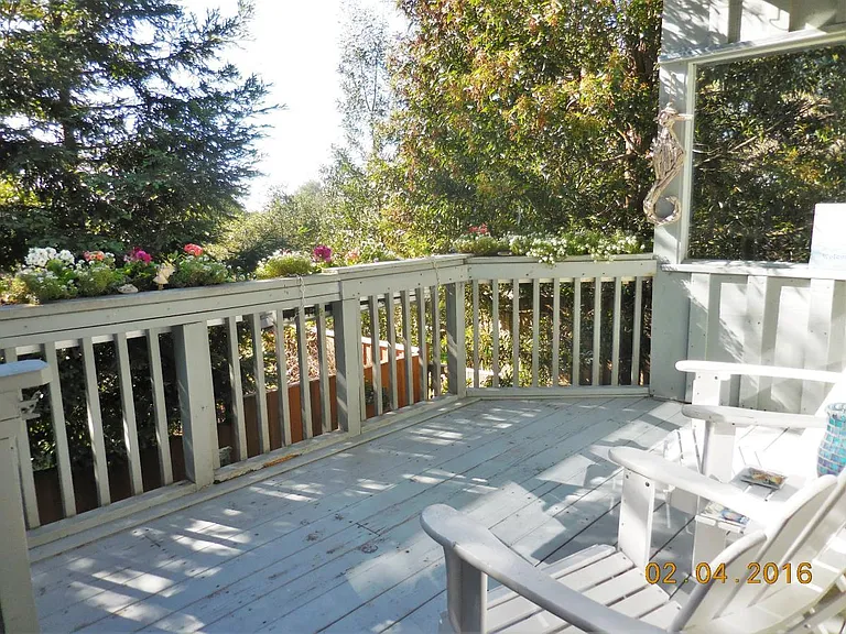 Deck with flowers, birds and trees