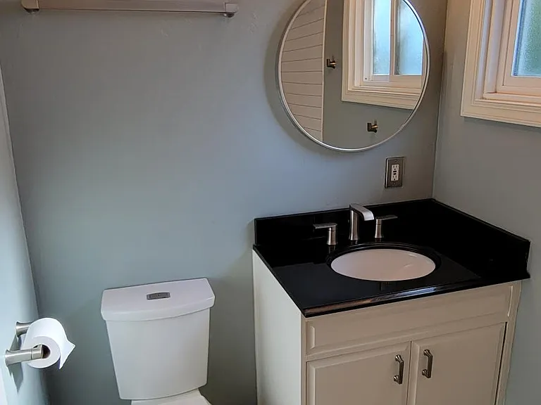 Guest Bathroom with window and ceiling heater fan..