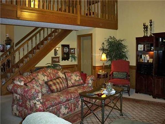 The living room is spacious & inviting...painted in a warm neutral tone.