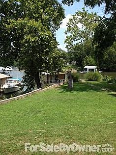 Lakefront View
						:
						Gentle slope to dock & lake. Quiet cove with deep water. 116ft. lakefront.