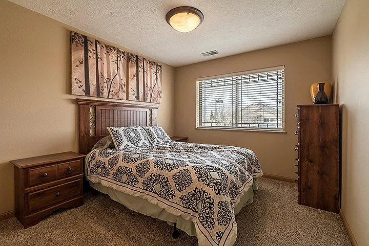 Unwind in a spacious bedroom designed for comfort and style.