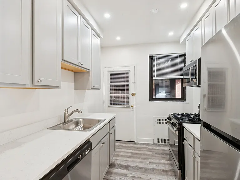 Kitchen
- stainless steel appliances including dishwasher, microwave oven, gas stove and fridge/freezer
-modern grey cabinetry
-quartz countertops