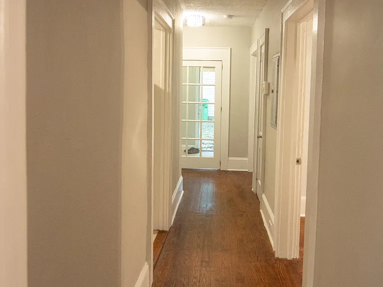 Hallway: Kitchen & Bathroom on left; Bedrooms on right. Mudroom in back.