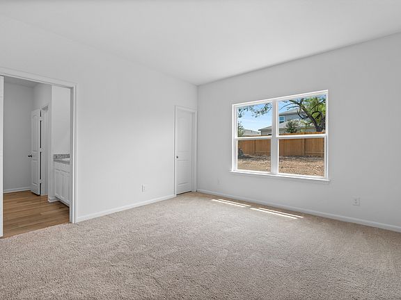 The secluded master retreat has its own walk-in closet and bathroom