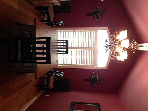 Dining Room with NEW hardwood floor & cathedral ceiling