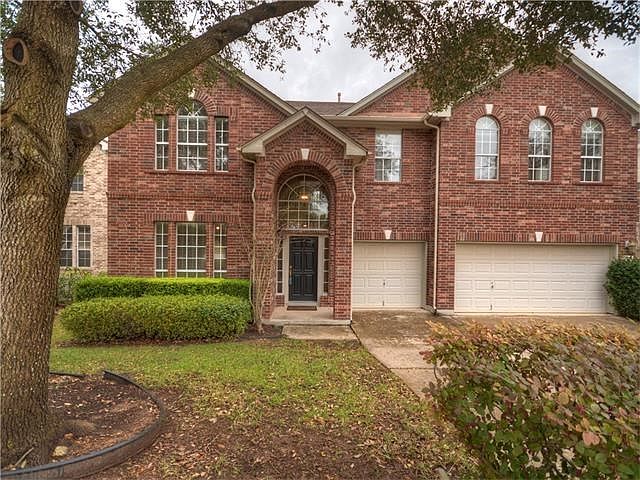 This stately two story home has four sides brick, covered front entrance, arched windows and a three car garage!