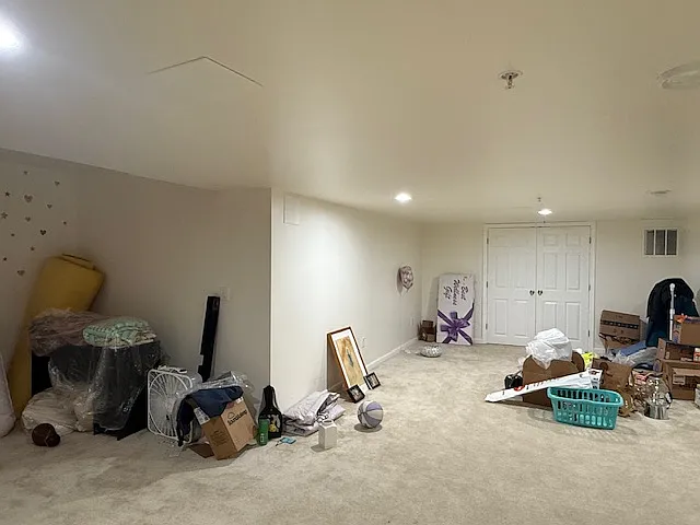 Large finished basement with recessed lighting