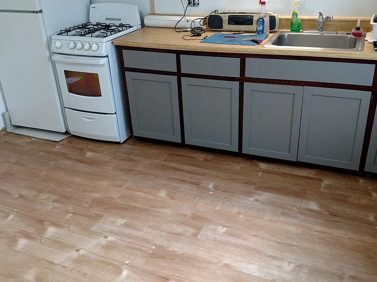 Newley refinished and painted kitchen cabinets, Hickory LVL flooring, looks great easy to keep clean.
