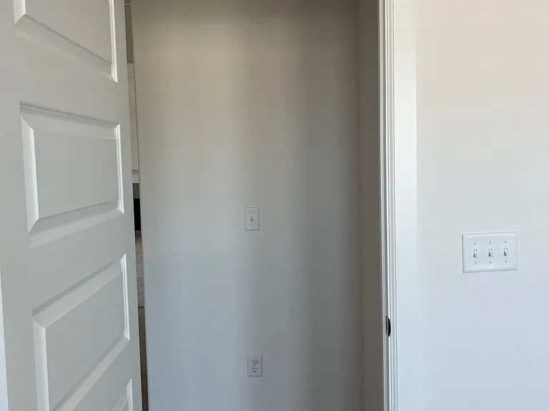 Hallway outside of primary bedroom.