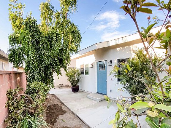 Private front patio with many trees