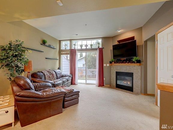 Living Room with gas fireplace a nook for ? and entry closet.