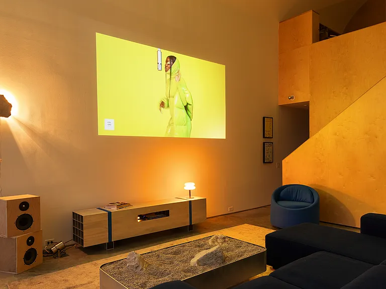Living room - pictured at night with art deco lamps and projector TV