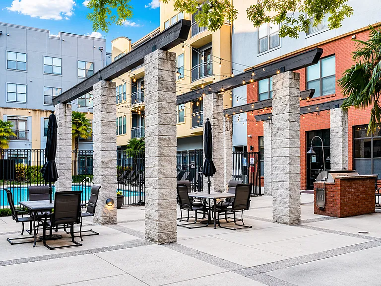 BBQ and grill area overlooking the pool_perfect for relaxing, dining, and entertaining guests.