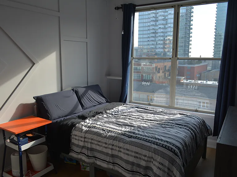 Bedroom with huge east-facing windows allow tons of natural light