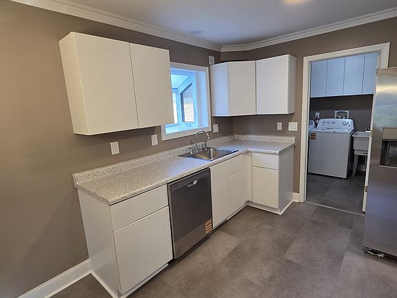 Complete kitchen remodel with all new cabinets, countertops, and appliances.