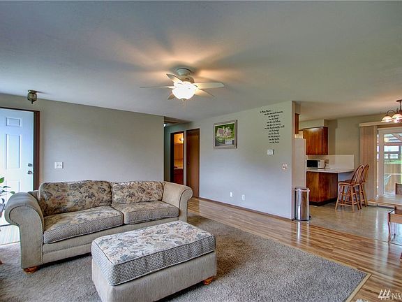 Carpet has been inset within the engineered hardwood surrounding for a clean cozy feel.  