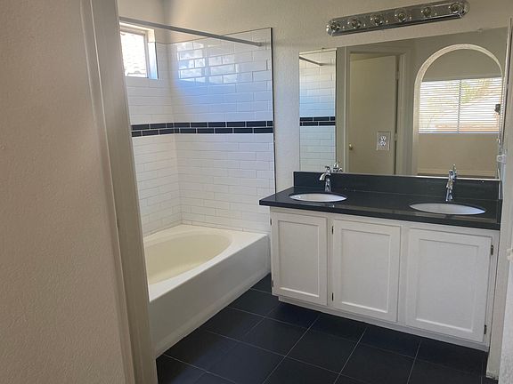 Quartz countertops and tile floors with garden tub/shower and walk-in closet separate toilet closet. Master Bath
