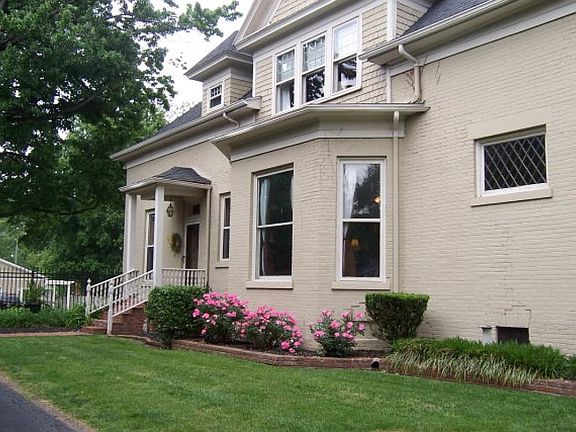 side yard with porch and another leaded glass door 