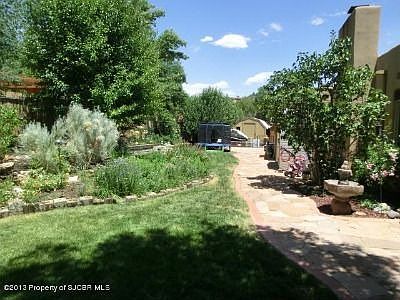 The back yard is beautifully landscaped