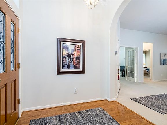 Open the door, you are home! Gorgeous hardwood flooring defines the entry, and then you walk past the arched entry into the main living spaces!