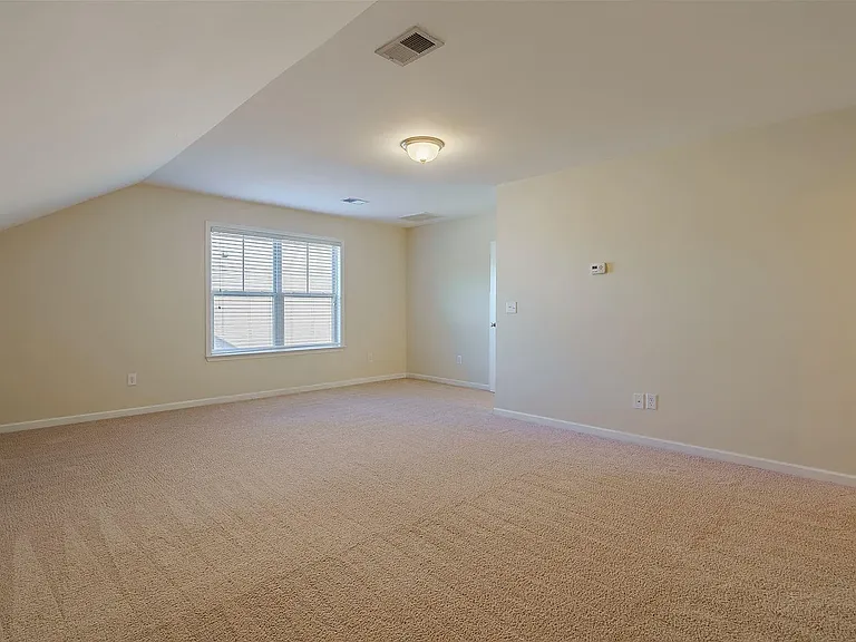 Extra large upstairs bedroom with spacious closet and full bathroom.
