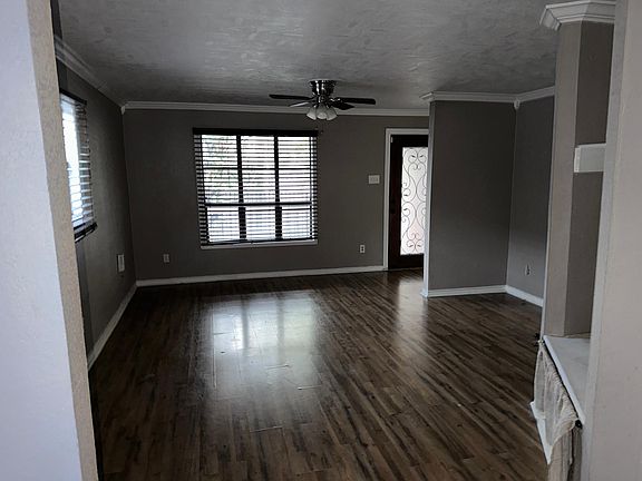 Enter the front door and walk into the spacious living room.