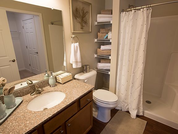 Master bathroom with granite countertops and walk-in shower