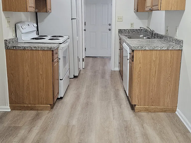 Kitchen .laundry room through door . Back door exit
