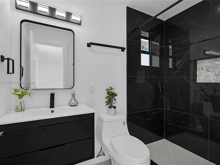 7501 Raleigh St — Photo 13