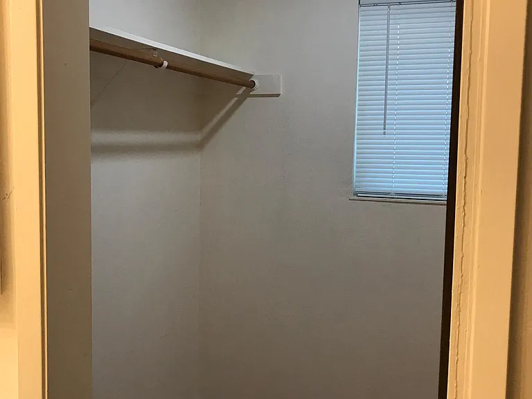 Master bathroom large size walk-in closet with window