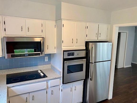 Prepare a delicious meal in the kitchen with updated appliances.