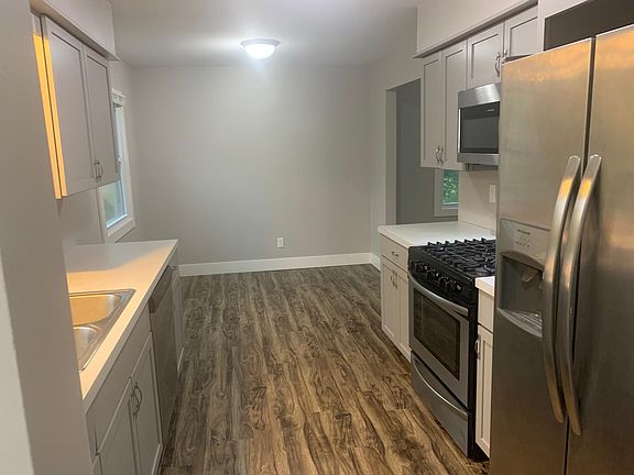 Looking from the entry through the kitchen to the Dining area.