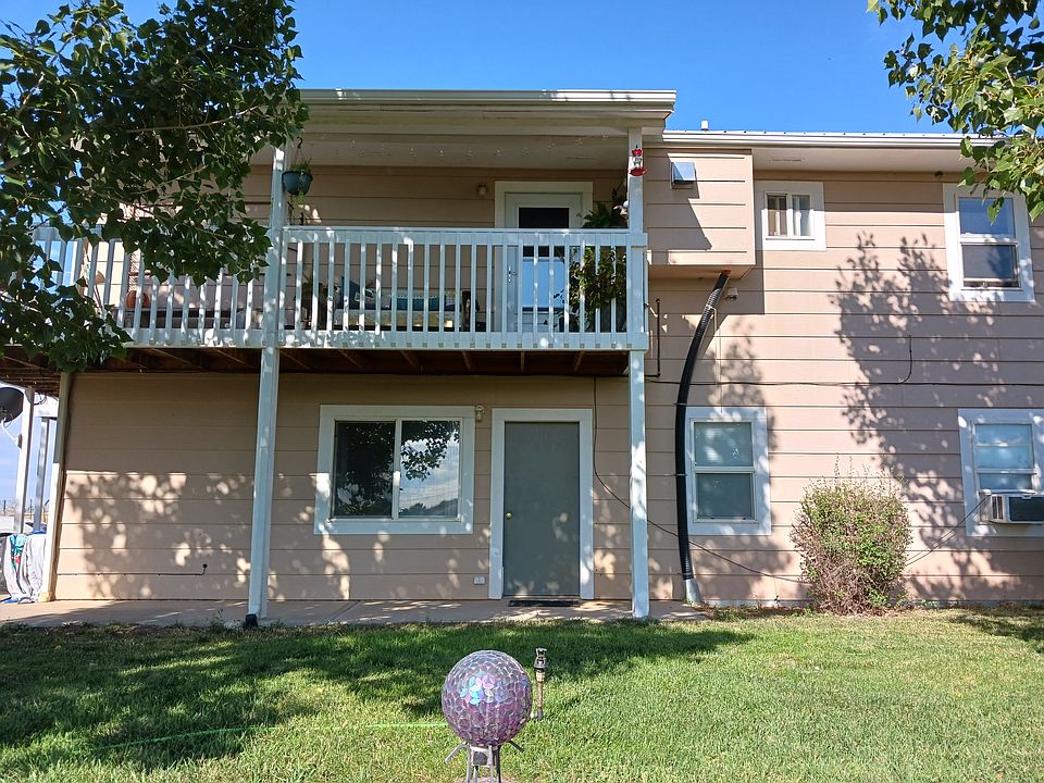 Side entrance with small patio